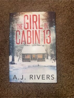 The Girl in Cabin 13 by A.J. Rivers - Red & White Cover